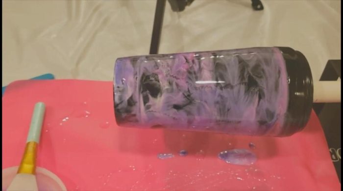 Smoky purple alcohol ink effect on an epoxy tumbler made by dragging a silicone brush